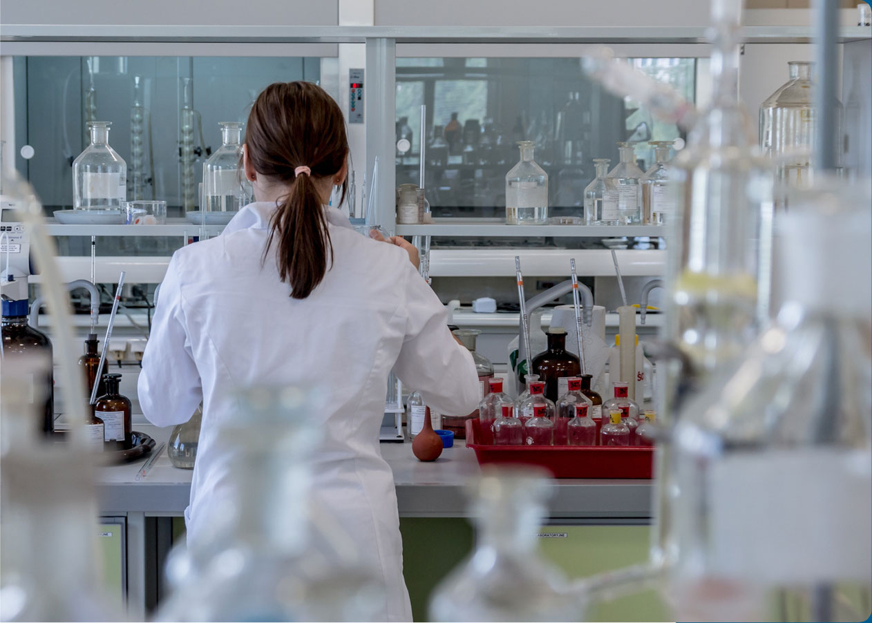 Stock image of lab technician in lab back view